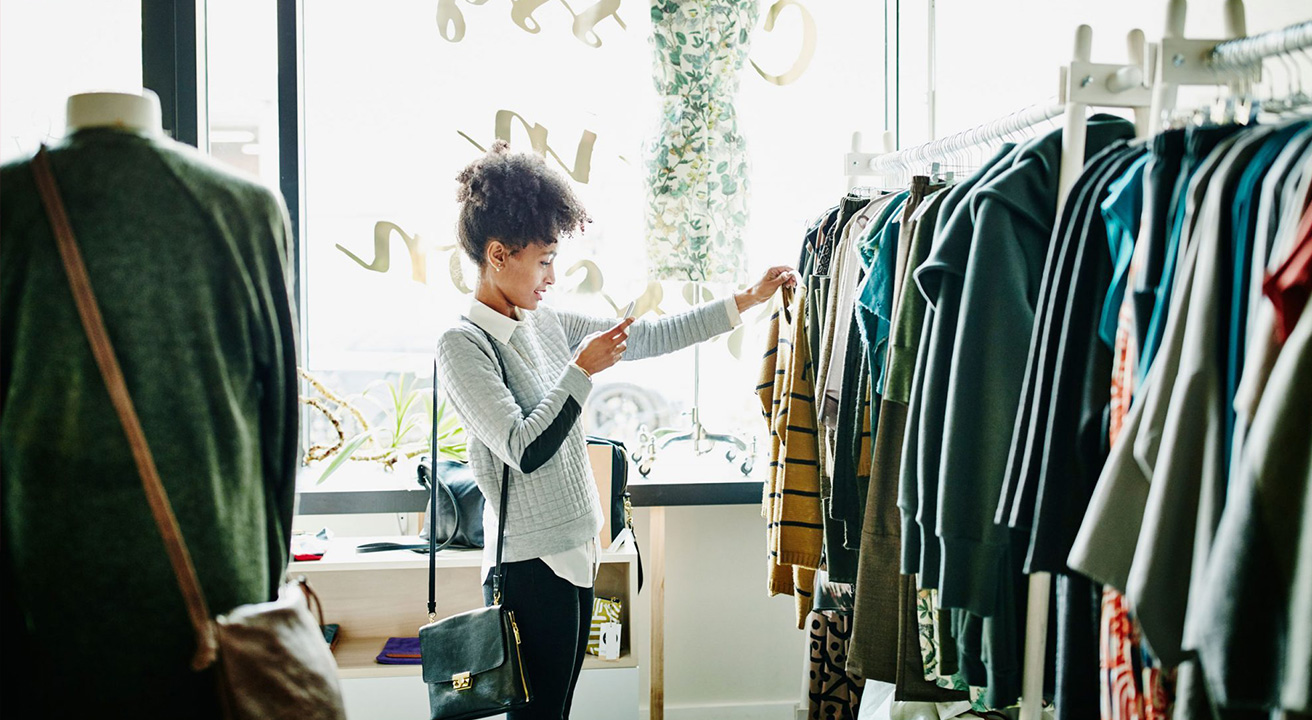 Woman looking for clothing deals in shop