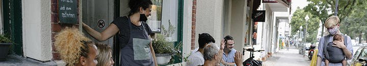 mum with child walking past restaurent