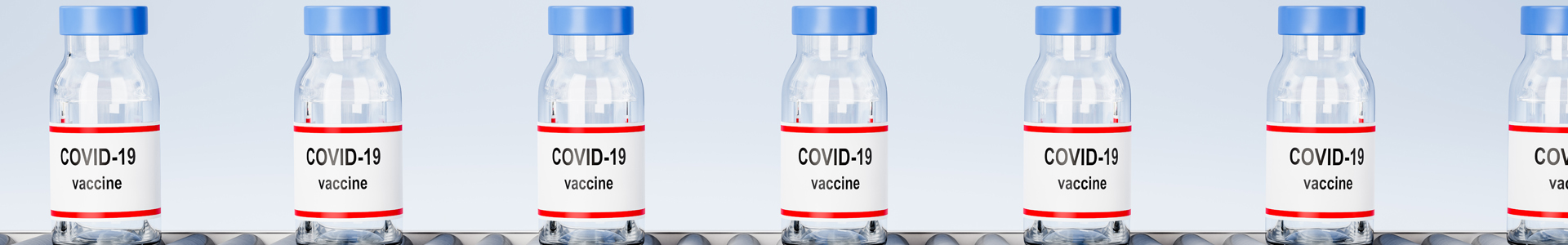 Covid-19 vaccines on a conveyor belt