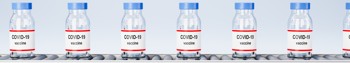 Covid-19 vaccines on a conveyor belt