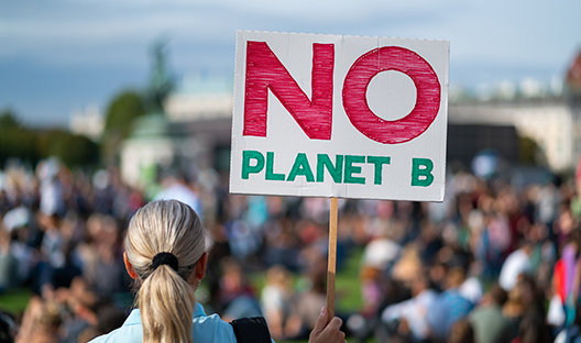 Protestor with sign saying No Planet B