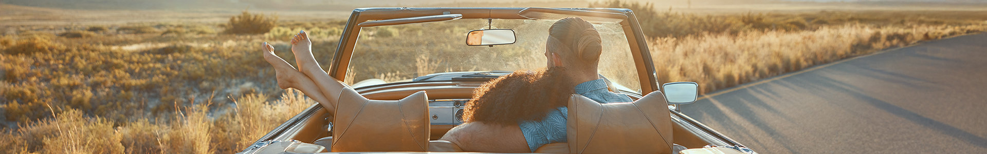 Couple in their converticle car on a roadtrip