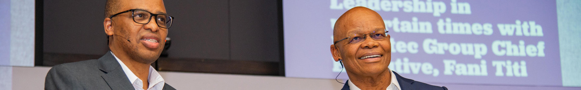 Investec Group Executive Fani Titi and GIBS Dean Professor Morris Mthombeni