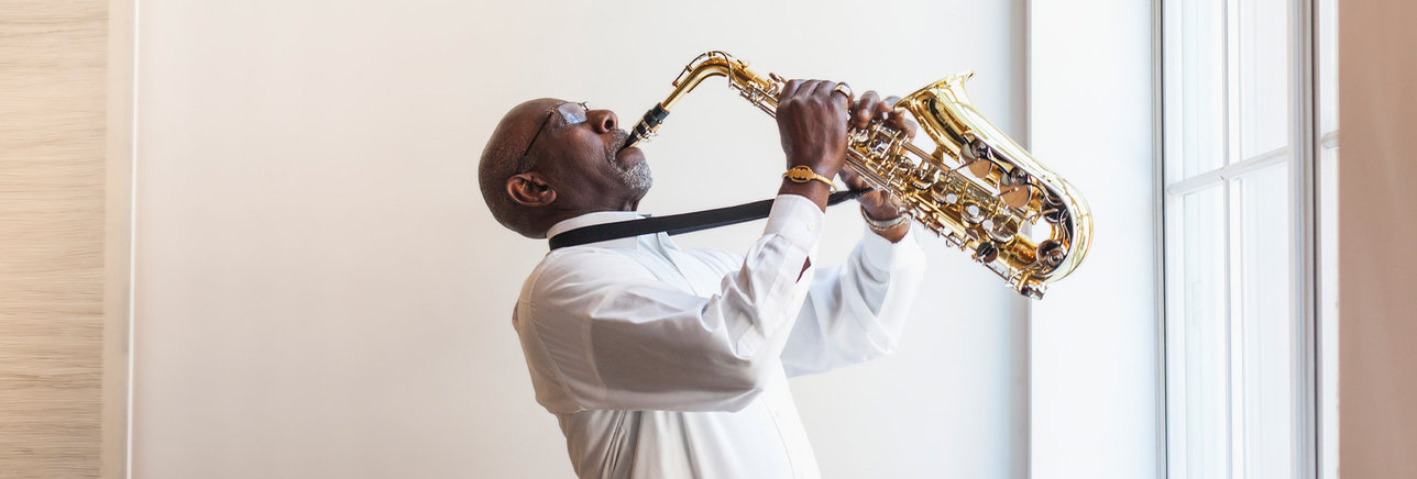 Older man playing the saxophone