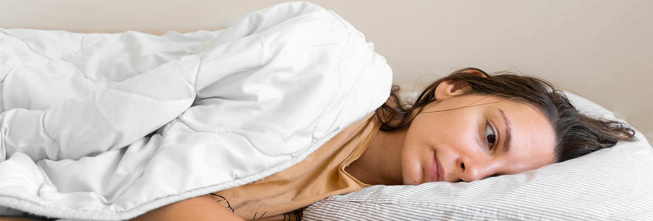 Female getting rest in bed
