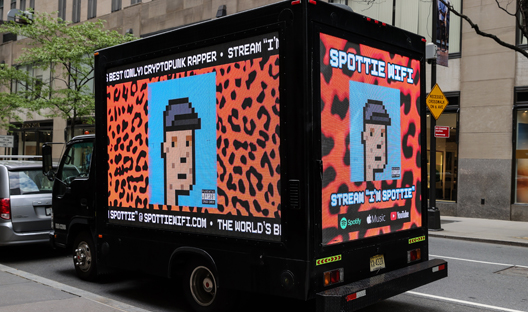 One of Larva Labs’ CryptoPunks displayed on a van outside Christie's