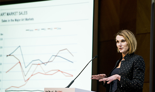 Woman presenting the Art Basel and UBS Survey of Global Collecting  figures
