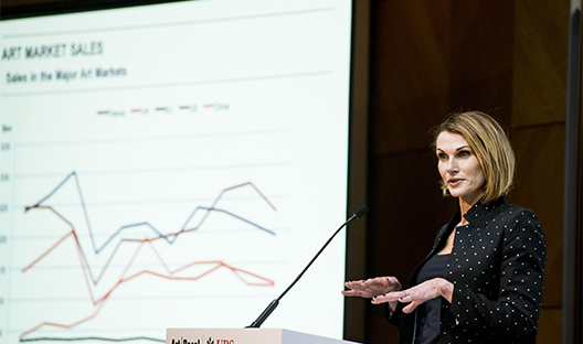Woman presenting the Art Basel and UBS Survey of Global Collecting figures
