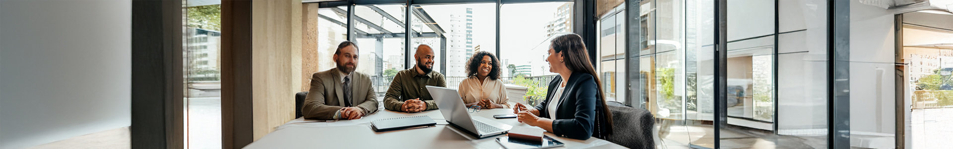 clients and advisor having a discussion around a table