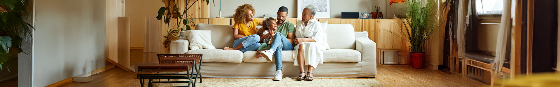 family sitting on a couch in their home