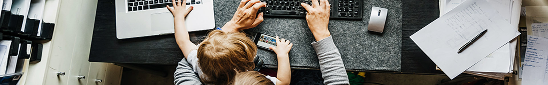 Father and son at work desk - working from home