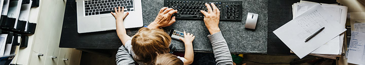Father and son at work desk - working from home