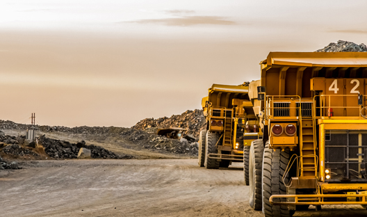 Platinum ore being transported by mining trucks