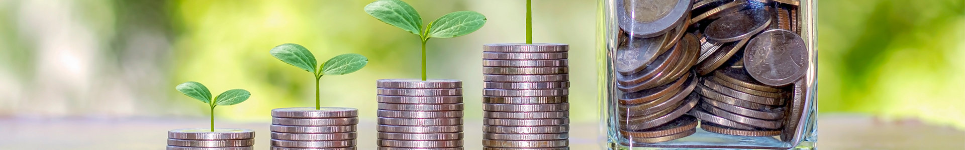 Stacks of coins and a jar of coins showing growth