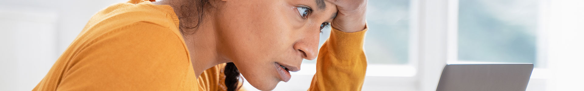 Woman stressed at her computer