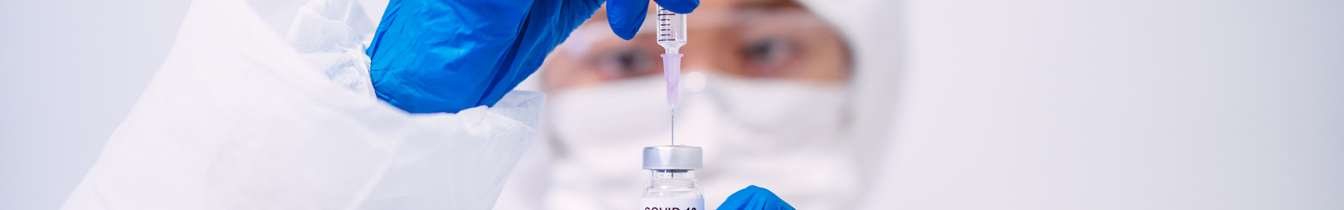 Medical professional holds a Covid-19 vaccine