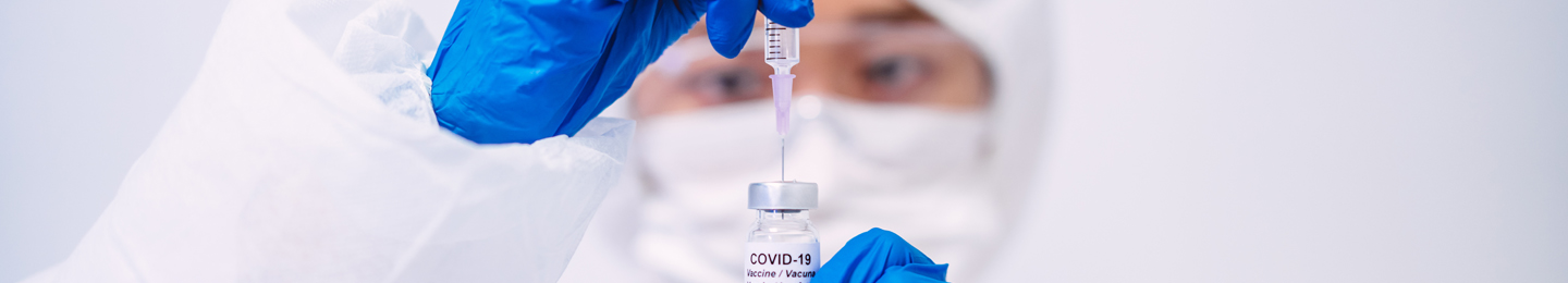 Medical professional holds a Covid-19 vaccine