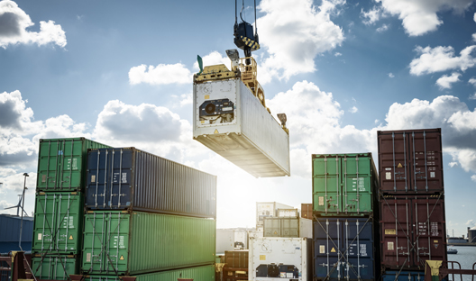 Containers being loaded onto a ship