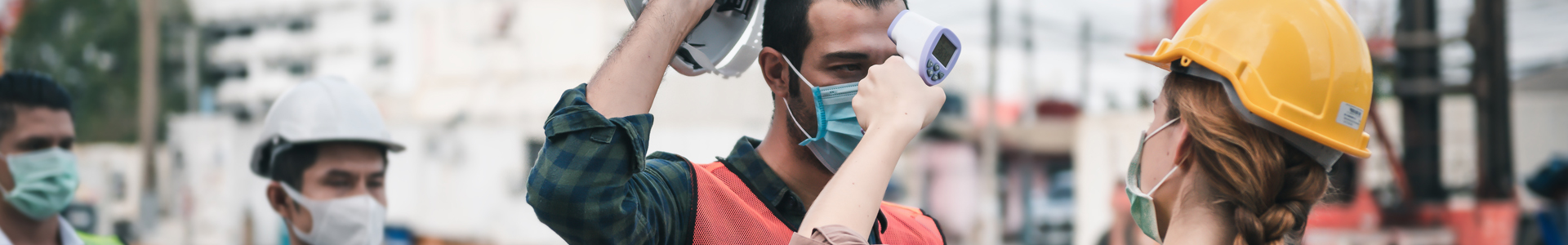Woman checks the temperature of workers at a port