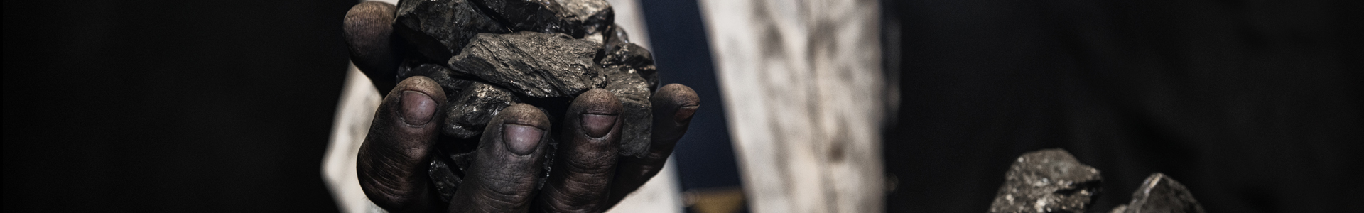 Hands holding coal