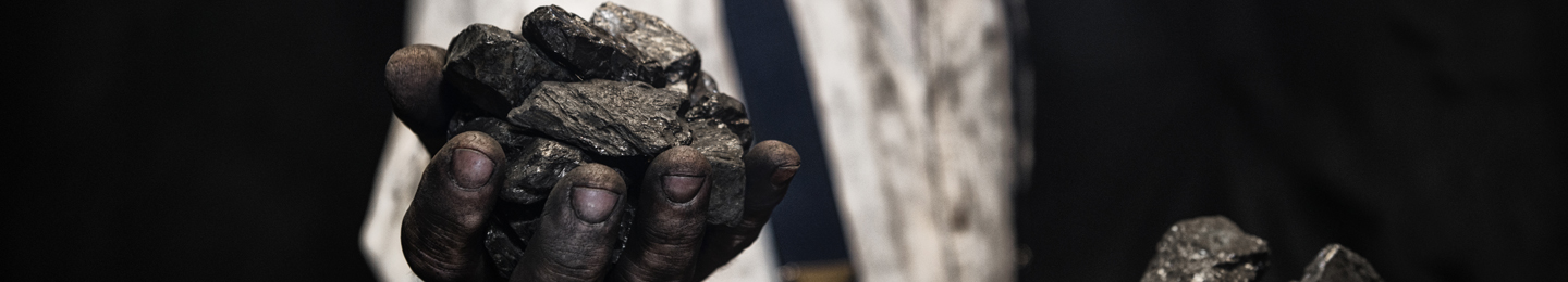 Hands holding coal