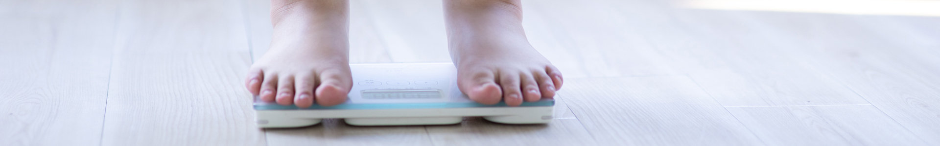 Feet standing on a scale