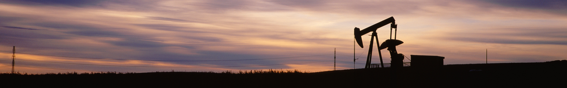 Oil pump jack at sunset