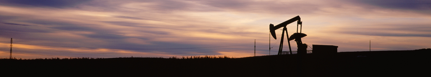 Oil pump jack at sunset