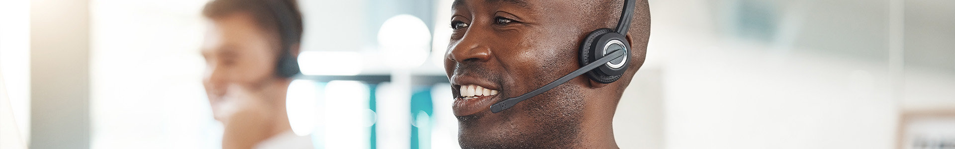 Two men working in a call centre