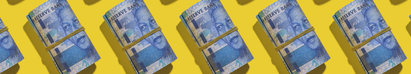 Row of rolled up R100 notes
