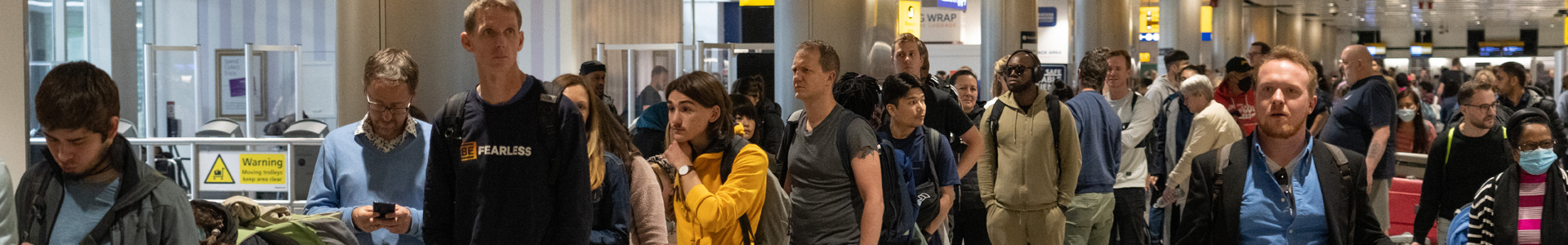 Travellers queue in UK airport