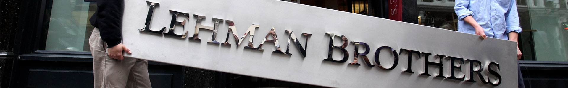 Lehman Brothers sign being carried away