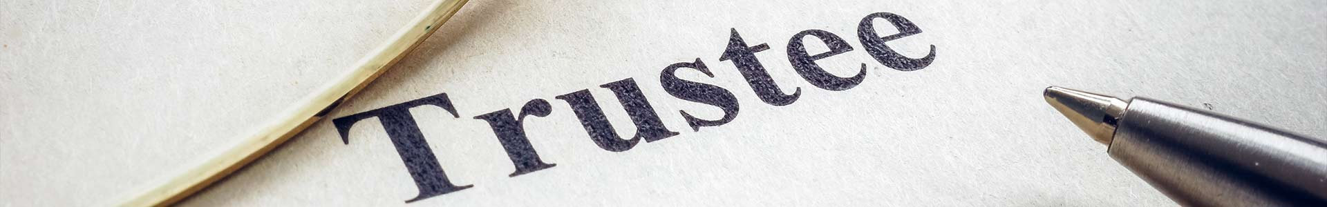 The word 'Trustee' on a peice of paper