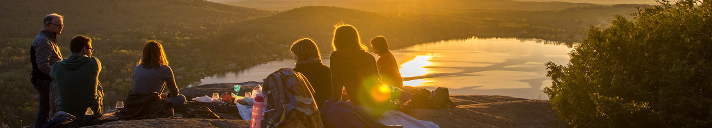 Family picnic overlooking lake