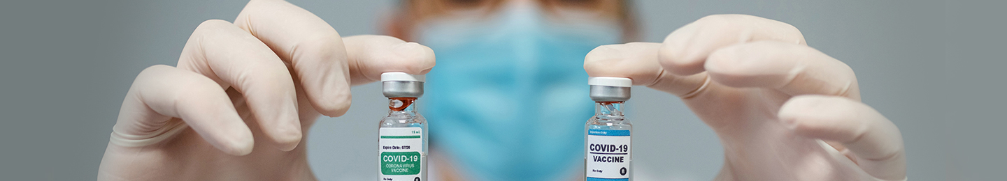Doctor holding vaccines