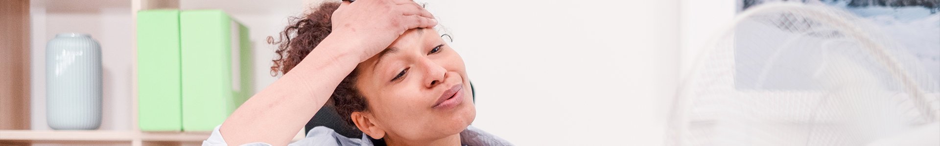 Woman holding her head appearing stressed