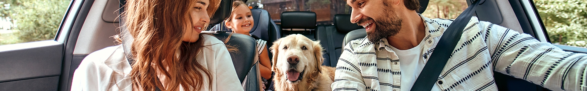 Family in a SUV with the dog