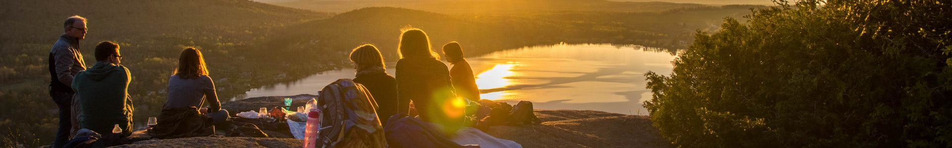 Family picnic overlooking lake