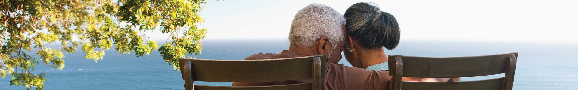 Eldery retired couple on deck chairs