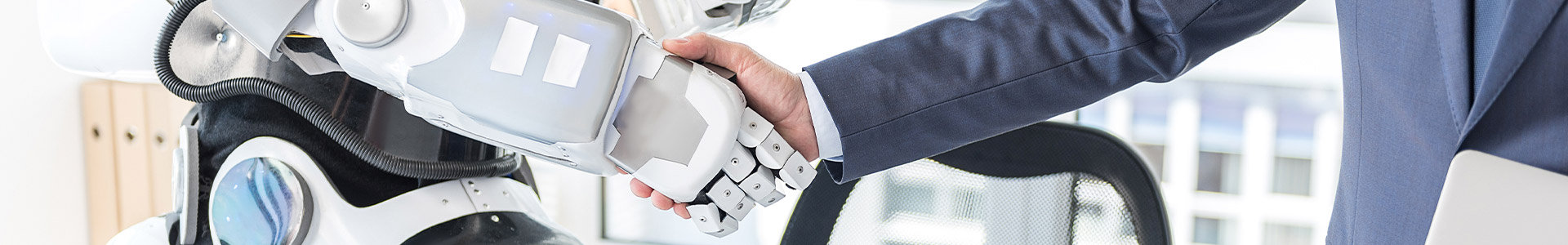 AI robot shaking hands with a business man