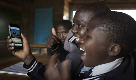 School children on a mobile phone