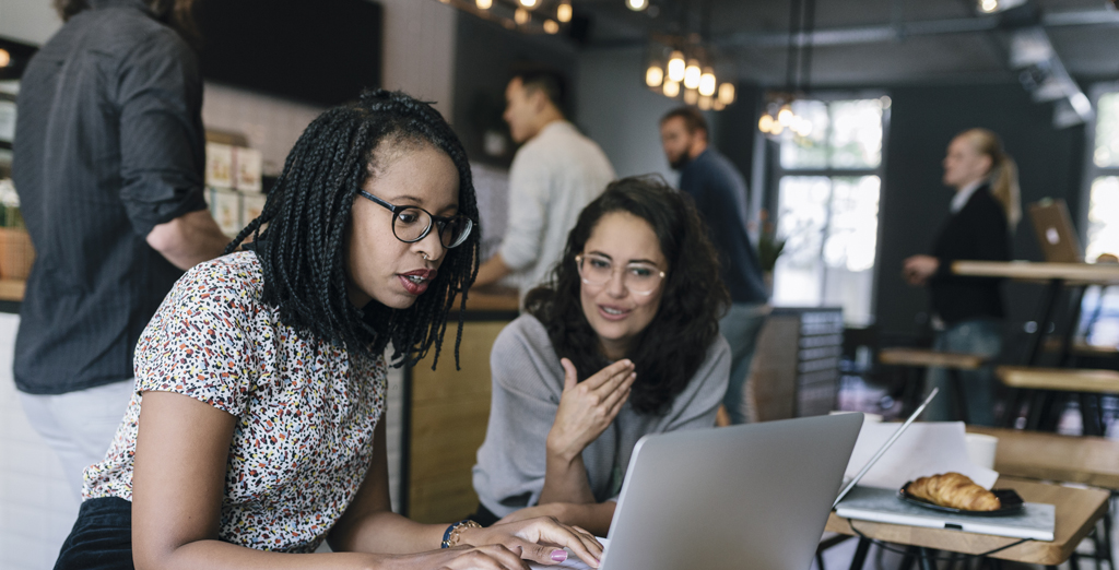 Female entrepreneurs working in cafe