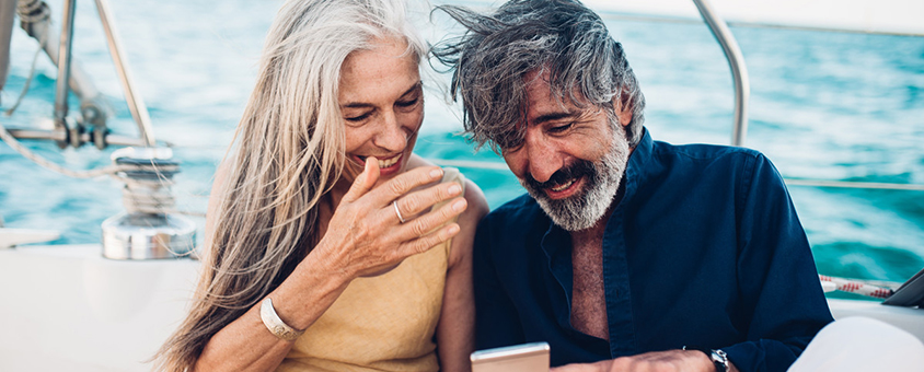 Couple in their golden years on a private yacht