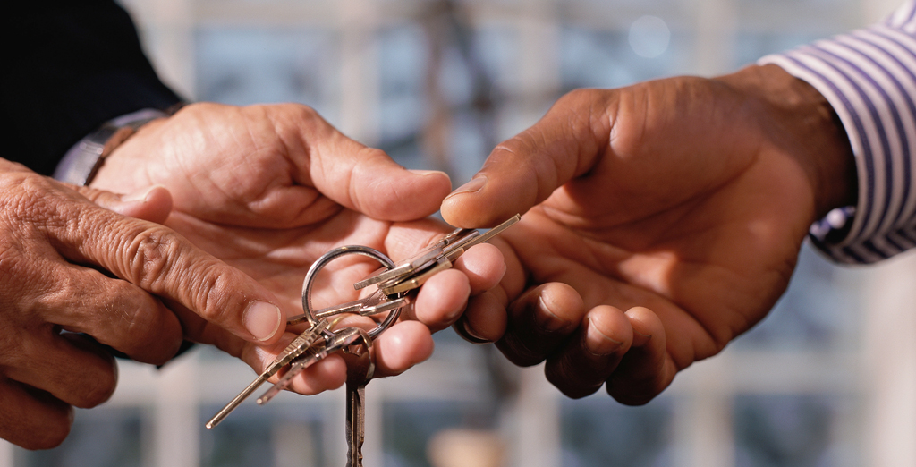 hand holding a key