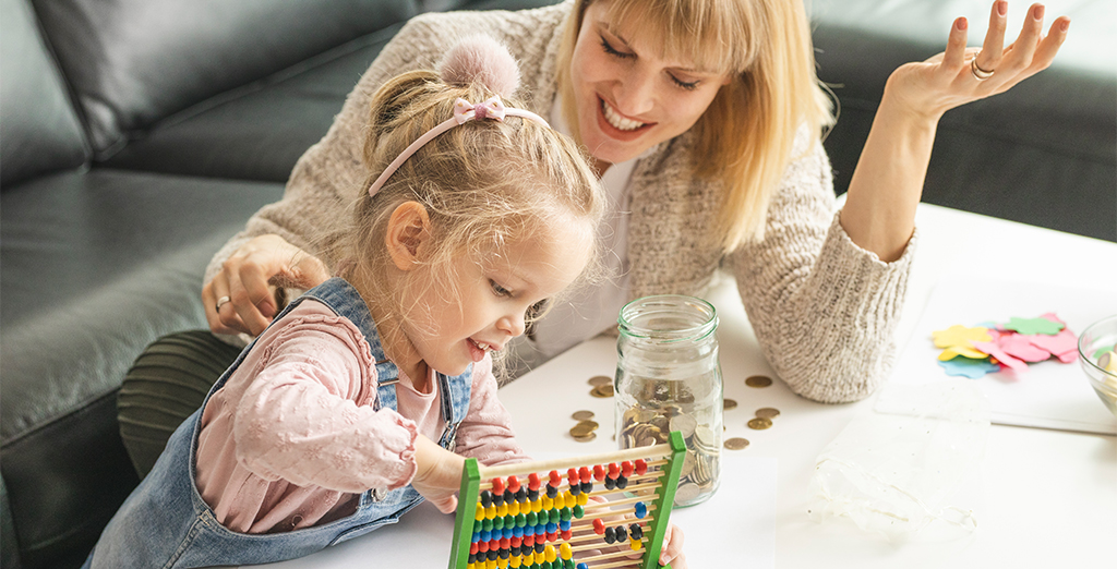 Investec Youth Account: Little girl and her mom counting on an abacus