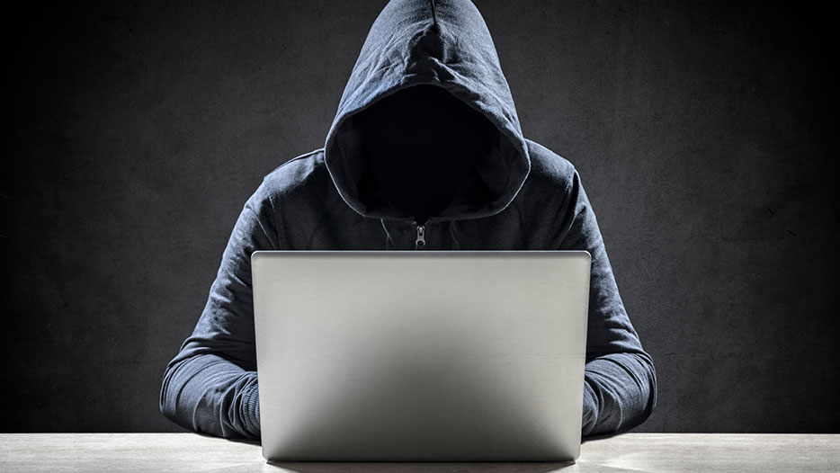 hacker working on a laptop