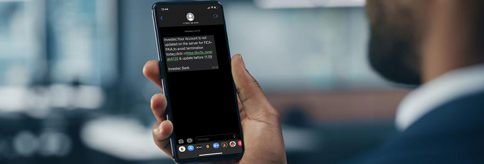 man receiving a phishing scam on his phone
