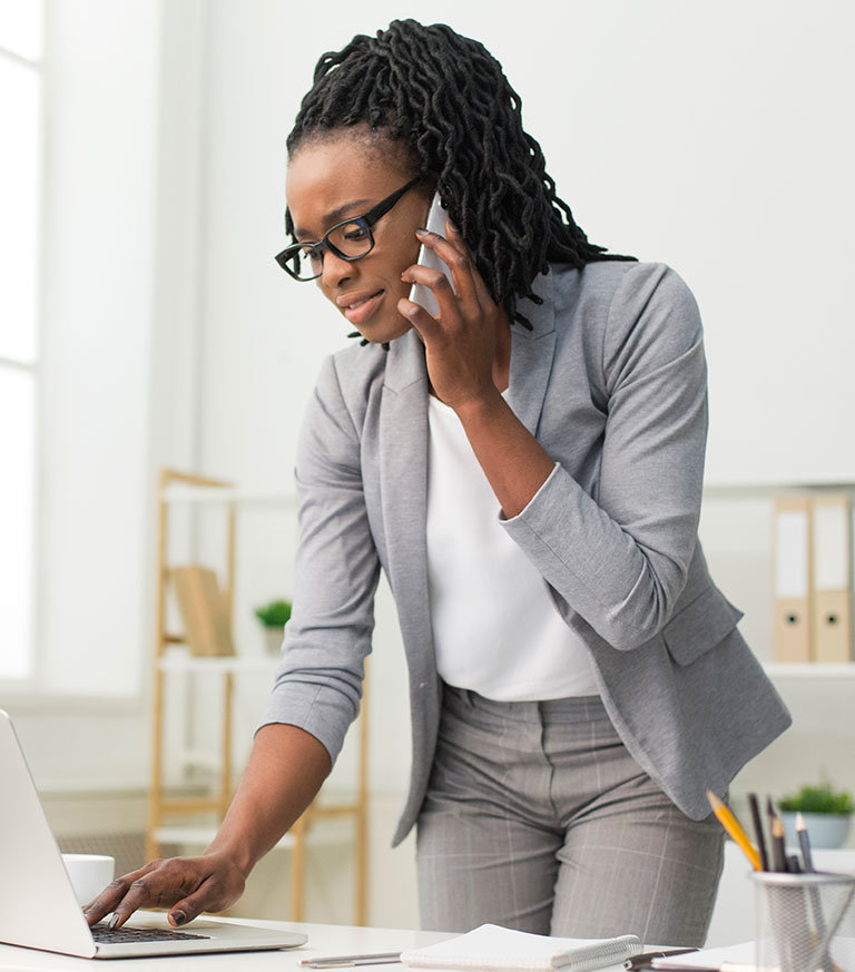Young professional bank account | young man on their tablet in the office