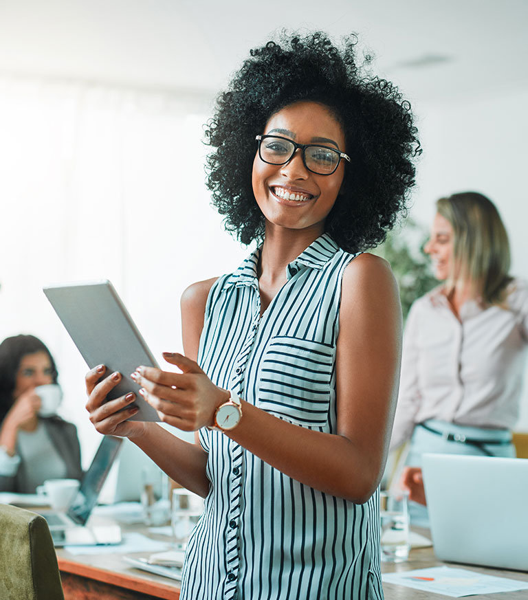 Lady working on her tablet in an office space