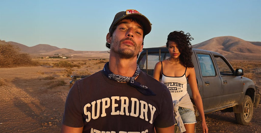 Superdry models standing in nature